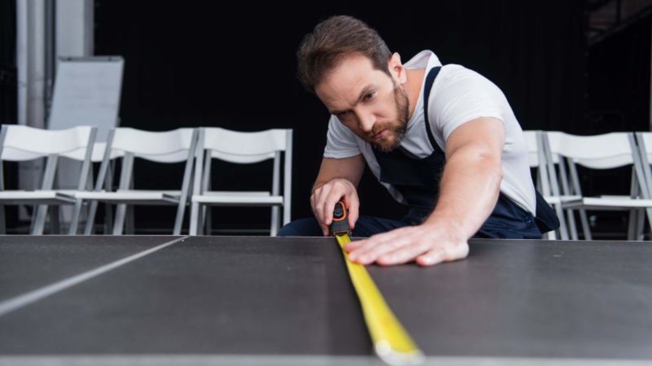 concentrated-male-craftsman-in-working-overall-mak-2023-04-11-18-13-18