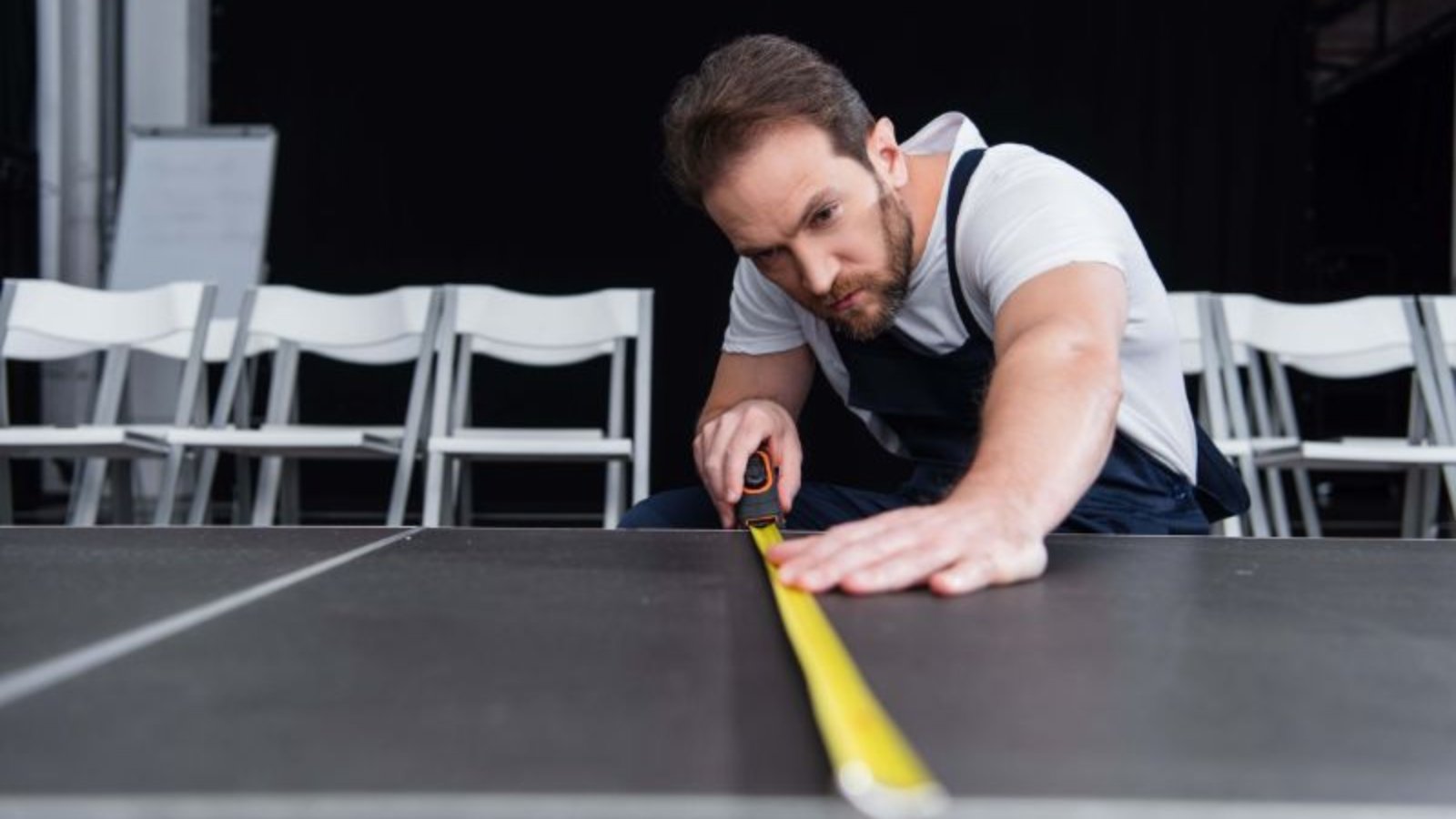 concentrated-male-craftsman-in-working-overall-mak-2023-04-11-18-13-18